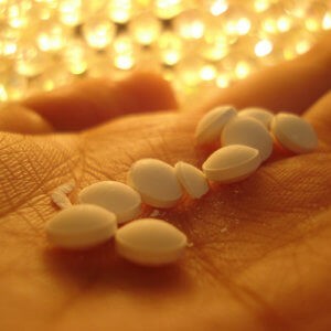 White Pills In Hand